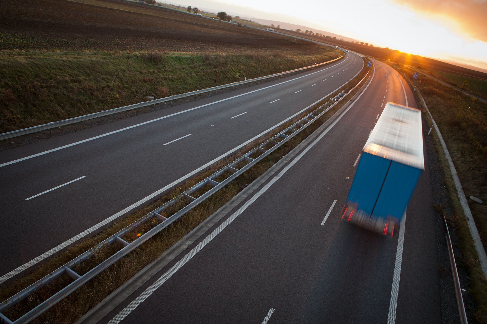 highway traffic - motion blurred truck on a highway/motorway/spe